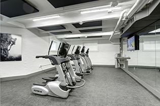 Large gym mirror wall installed by Design Glass & Mirror