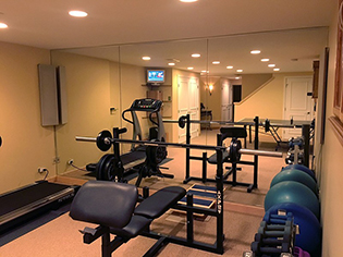 Full wall gym mirror installation for fitness center