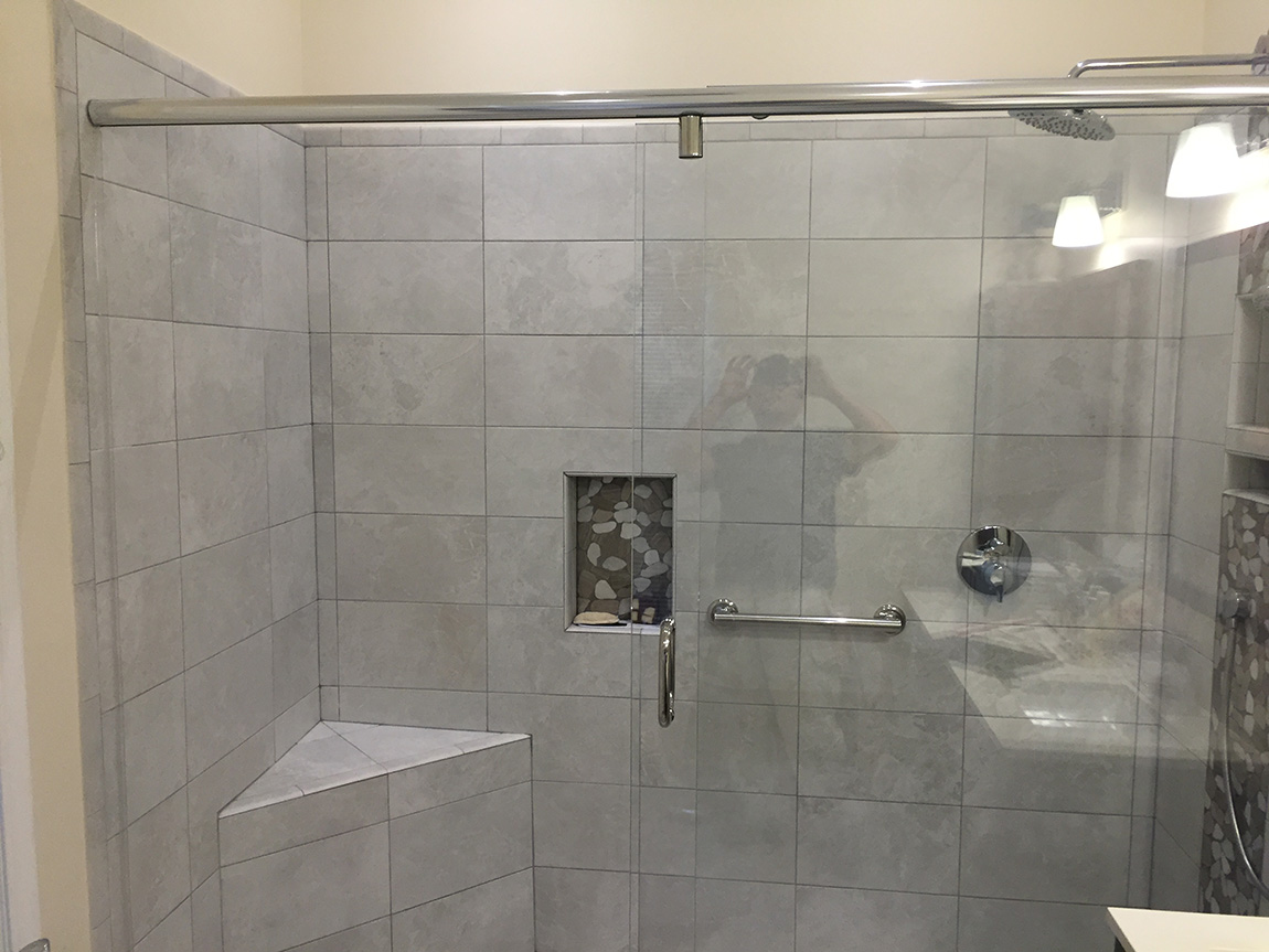 Custom frameless shower enclosure installation by Design Glass & Mirror - example 1
