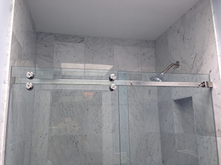 Custom frameless shower enclosure installation by Design Glass & Mirror - example 4